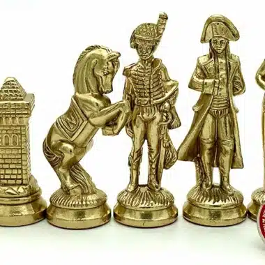 Pièces dorées style Napoléon figurant tour, cheval et personnages militaires